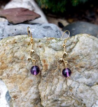 Bright faceted 6mm Amethyst beads drop from a tree branch styled piece. The earrings are gold plated Sterling Silver. The total length of the drop is 33mm.