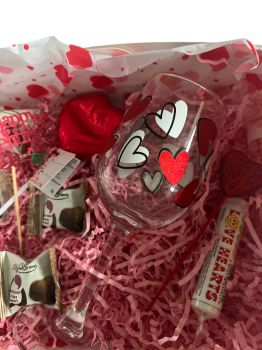 &nbsp;
A stunning Valentine&rsquo;s gift box featuring a love heart wine glass, Lily O&rsquo;Brien chocolates, sweet treats and romantic details &ndash; beautifully presented and ready to gift.
&nbsp;