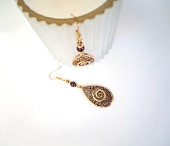 Gorgeous filigree earrings handmade in Ireland with quality materials. Created with antique gold tone filigree drops, gold plated and glass beads. Suspended from gold plated, nickel free ear hooks.&nbsp; (drop 5.7cm/2.25ins).&nbsp; Perfect for boho lovers! Treat yourself to these beautiful, bespoke earrings... they arrive in a pretty organza bag, and have free shipping!