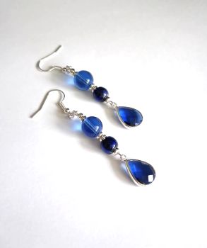 Beautiful glass drop earrings, handmade in Ireland with quality materials.&nbsp; Created with silver plated beads, gorgeous glass beads in varying shades of deep blue. Great for special occasions! Perfect for gifting, or a personal treat!&nbsp; &nbsp;free shipping!