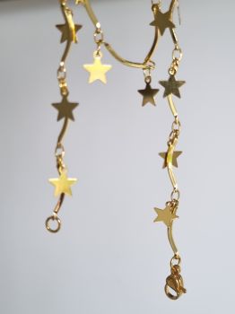 Gold necklace star charms linked with gold bar