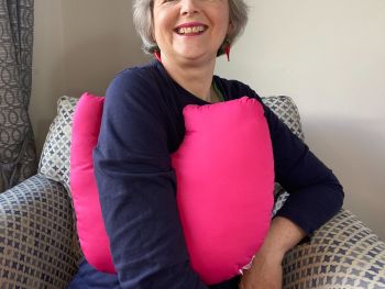 My breast cancer surgery support pillows are ideal for use directly after surgery, or in the following weeks while healing takes place. This support pillow is shaped to fit comfortably under the affected arm, and is filled with high quality polyester filling to a fairly firm finish, perfect to provide adequate support and comfort. This pillow reaches mid chest in width, so it will easily cover the surgery area, and provide support&nbsp; and padding.
It measures 43cm wide X 37cm long and 10 cm in depth. This cerise pink fabric is soft and breathable. All pillows come with a handmade with love by Rodgerson Handcraft label and are reversible.