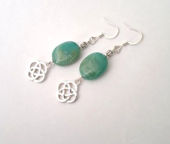 Beautiful celtic knot earrings, handmade in Ireland with quality materials.&nbsp; Created with acrylic marbled beads in a beautiful green, with silver plated celtic love knots.&nbsp; &nbsp; These gorgeous earrings are light and comfortable to wear.&nbsp; &nbsp; &nbsp; &nbsp; Great for lovers of celtic jewellery.&nbsp; &nbsp;Perfect for gifting, or for a personal treat!&nbsp; They arrive in a pretty organza or velvet pouch, and have free shipping!