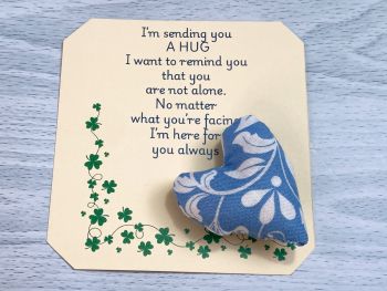 These are&nbsp; my sending you a hug fabric pocket hugs. This is my sky blue with white flowers print. Each pocket heart is handmade in a soft cotton fabric and filled to medium firmness. There is option to chose home grown dried lavender in your heart, at no extra cost.&nbsp;
Each pillow can vary slightly as each are handmade.&nbsp;
Each comes attached to a cream and shamrock patterned card to tell the person you are gifting them a hug. Each card measures 10cm X 10.5cm. It's blank on the back so you can write a message
* I am a breast cancer survivor myself so I understand how individuals undergoing cancer treatment just need a hug and sometimes you can't do that.&nbsp; &nbsp;
