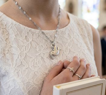 Zinc alloy dove charm with 18k gold plated chain.