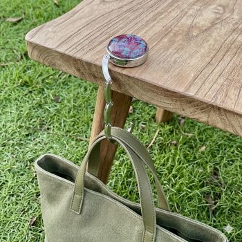 Portable handbag holder.