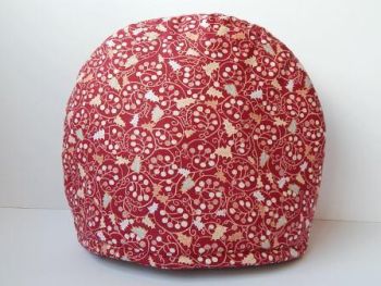 Keep your teapot warm with our fun and functional tea cosy.
Deep red Christmas fabric&nbsp; . Handmade by Gl&eacute;asta.