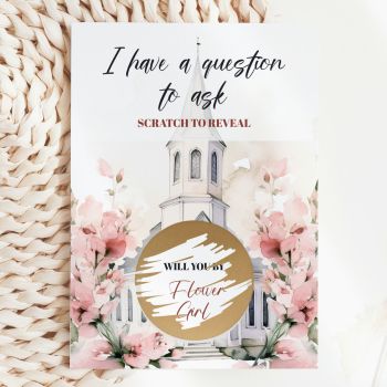 The Sweetest Way to Ask ⛪️🌸
Imagine handing this gorgeous card to the little girl you&rsquo;ve chosen to walk down the aisle scattering petals on your wedding day. She reads "I Have a Question to Ask &mdash; Scratch to Reveal", picks up a coin, and scratches away the gold circle to discover: "Will You Be My Flower Girl?" That moment of pure, breathless delight &mdash; handmade in Ireland by Printarelle.

Featuring the same dreamy watercolour scene as our Bridesmaid card &mdash; a white chapel framed by oversized blush pink sweet peas and soft green foliage &mdash; but with a distinctive burgundy "Scratch to Reveal" text that gives this version its own warm, romantic character. The gold scratch-off circle sits right at the heart of the chapel illustration, making the reveal feel truly magical.