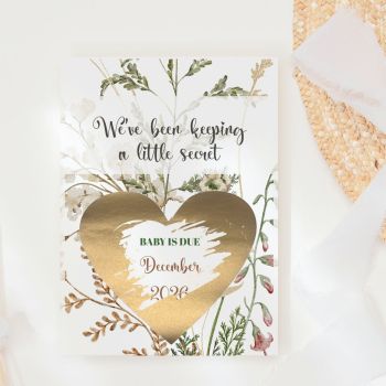 We've Been Keeping a Little Secret 🌿✨
Delicate sage ferns, dried grasses, soft white blooms, and tiny blush wildflowers drift across a warm cream background, this is the most natural and serene way to share your pregnancy news. They read "We've Been Keeping a Little Secret" in elegant black script, pick up a coin, and scratch away the gold heart to discover your baby's due date. That gasp of pure, breathless joy, handmade in Ireland by Printarelle.

What makes this design truly special is its boho botanical aesthetic, a warm cream background with scattered dried grasses, sage ferns, white gypsophila, and delicate pink wildflower buds, all in a loose, organic arrangement. Earthy, natural, and utterly timeless. A world apart from the bold purple peony and lilac rose versions.