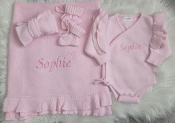 Our 4 piece baby girl set includes our frill edge blanket, frill shoulder wrap romper, booties and headband . Name is embroidered on blanket and romper, heart can be added just write heart after name .