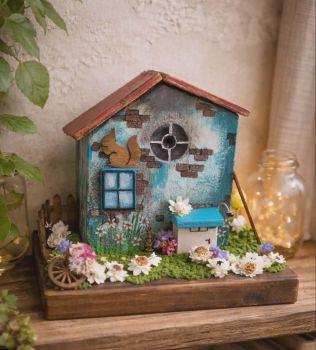 Handcrafted tiny wooden house, painted with acrylic colour and decorated with dry flowers!