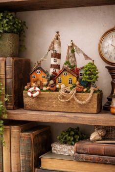 Handmade driftwood harbor scene featuring a lighthouse. cottages and nautical accents, hand painted with acrylics and detailed with dry flowers!