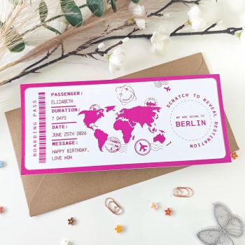 The destination is a secret &mdash; until they scratch to reveal it.
This personalised scratch-to-reveal Berlin boarding pass is finished with a vibrant hot pink holographic foil that shimmers and dazzles at every angle. Hand-finished in Mallow, Cork, Ireland, it features a bold pink world map illustration, travel stamps, and a hidden destination circle revealing&nbsp;Berlin&nbsp;&mdash; covered with a scratch panel for that unforgettable reveal moment. It's not just a gift. It's a moment.