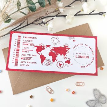 The destination is a secret until they scratch to reveal it.
This personalised scratch-to-reveal London boarding pass is finished with a bold red holographic foil that shimmers and catches the light with every angle. Hand-finished in Mallow, Cork, Ireland, it features a striking red world map illustration, travel stamps, and a hidden destination circle revealing&nbsp;London covered with a scratch panel for that magical reveal moment. It's not just a gift. It's a moment.