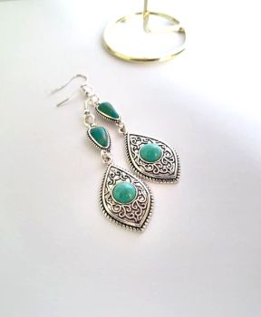 Beautiful bespoke earrings, handmade in Ireland with quality materials.&nbsp; A gorgeous combination of teal and turquoise with antique silver... They are lightweight and comfortable to wear, suitable for day or evening wear. Perfect for gifting, or a personal treat!&nbsp; They arrive in a pretty organza bag, and have free shipping!