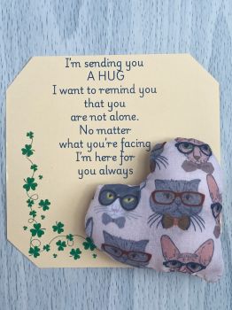 These are&nbsp; my sending you a hug fabric pocket hugs. This is my cats in glasses print. Each pocket heart is handmade in a soft cotton fabric and filled to medium firmness. There is option to chose home grown dried lavender in your heart, at no extra cost.&nbsp;
Each pillow can vary slightly as each are handmade.&nbsp;
Each comes attached to a cream and shamrock patterned card to tell the person you are gifting them a hug. Each card measures 10cm X 10.5cm. It's blank on the back so you can write a message
* I am a breast cancer survivor myself so I understand how individuals undergoing cancer treatment just need a hug and sometimes you can't do that.&nbsp; &nbsp;