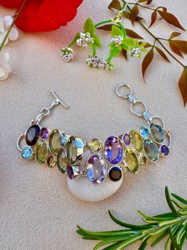 Handmade Silver Bracelet decorated with brilliant cut multi natural gemstones&nbsp;
Metal: Sterling Silver
Gem: Natural Green Amethyst, Amethyst, Citrine, Lemon Topaz, Garnet, Blue Topaz, Smoky Quartz
Bracelet Length: 16--20 CM(6.5 --8 Inches), adjustable
Bracelet Width: 22mm
Weight: Approximate 45.4g