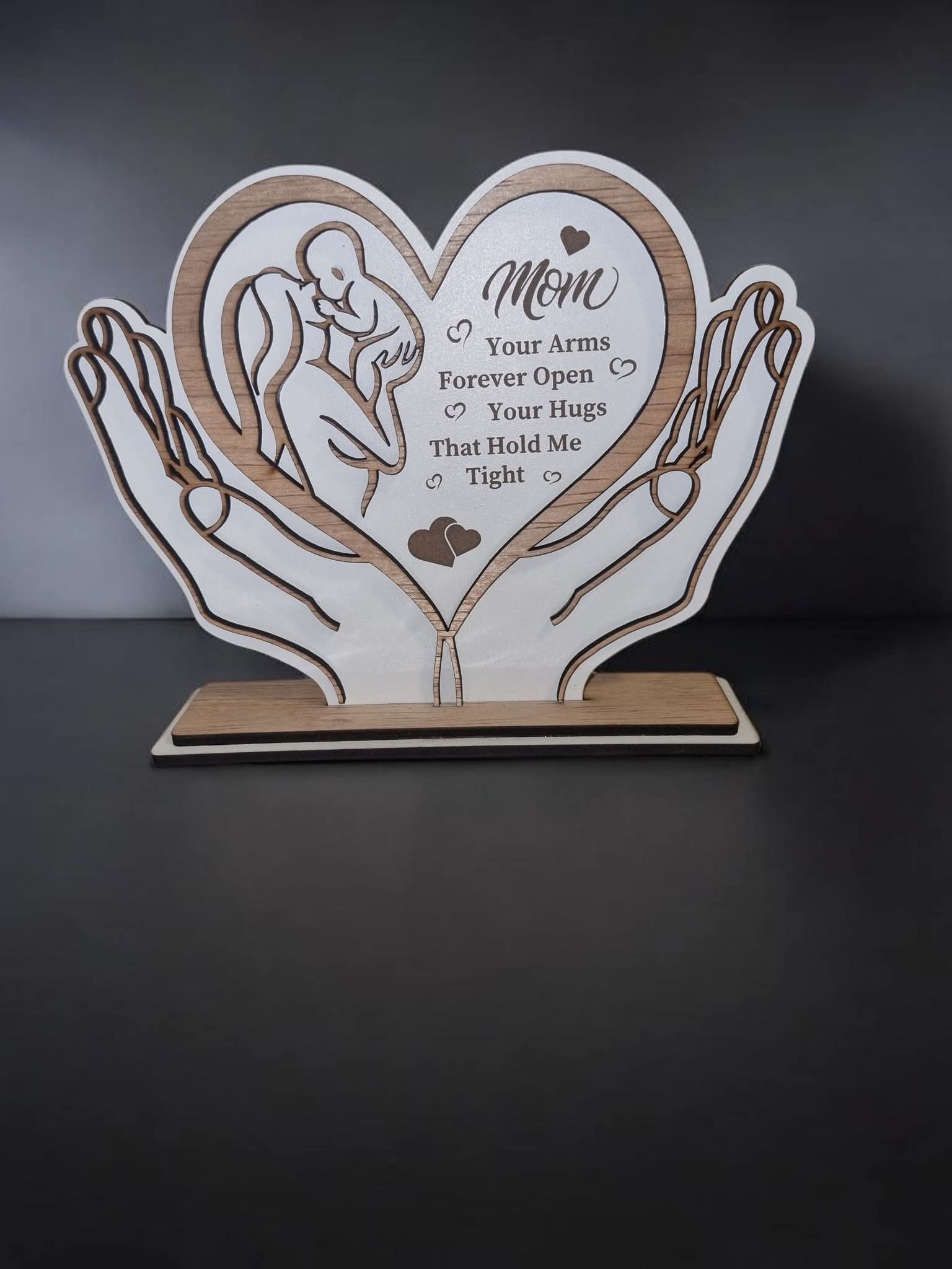 Wooden Mom Heart Plaque&nbsp;
&nbsp;
Beautiful handcrafted decorative plaque made from 3mm plywood, featuring a loving mother and child design inside a heart shape. A meaningful keepsake that symbolizes love, warmth, and family bonds.
A unique and heartfelt decoration that brings love to every home. 💖