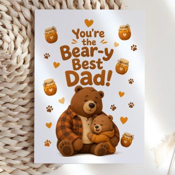 A big, warm bear hug in card form. This illustrated card reads "You're the Bear-y Best Dad!" above a large brown bear hugging a smaller cub close, surrounded by honey pots, orange hearts, and paw prints. Funny, sweet, and exactly the kind of card a dad actually keeps.