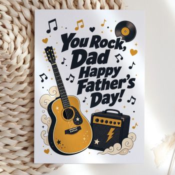 For the dad who has always been cooler than he lets on. This bold, illustrated card reads "You Rock, Dad, Happy Father's Day!" alongside a detailed acoustic guitar, a vintage amp, and a vinyl record, all framed by gold and black music notes. A card with real personality.