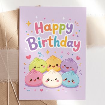 A whole squad of kawaii bao buns and every single one of them is excited about this birthday. Six colourful dumplings in green, yellow, purple, pink, cream and blue are packed together under a bold rainbow "Happy Birthday" greeting on this soft lilac card. They are adorable, they are enthusiastic, and collectively they are completely irresistible.