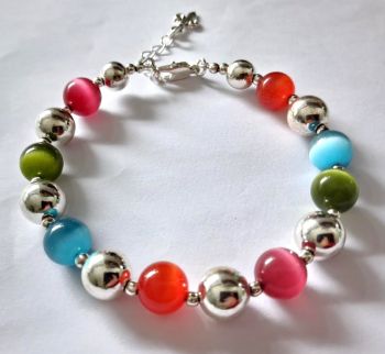 A gorgeous, brightly coloured handmade bracelet in lovely summer colours.&nbsp; Perfect for gifting or a personal treat!
