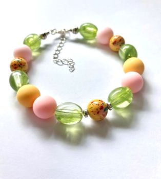 A lovely handmade bracelet in gorgeous summer colours with silver accents. Light and comfortable to wear... great for gifting or for a personal treat!