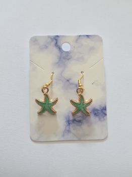 Cute green and coloured coloured charm earrings of a starfish.