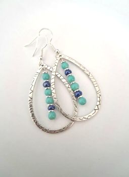 Gorgeous summer earrings, handmade in Ireland with quality materials. Created with silver plated open drops and acrylic and silver plated beaded centres in beautiful summer colours.&nbsp; &nbsp;Light and easy to wear.&nbsp; perfect for gifting or a personal treat!