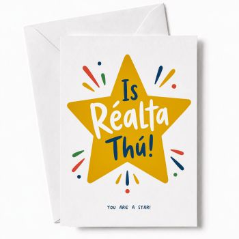 BOLD IRISH YOU ARE A STAR CARD: "Is R&eacute;alta Th&uacute;" means You Are a Star in Irish, displayed inside a bright golden star shape with the English translation printed below. A card that says well done without hedging, in two languages at once.