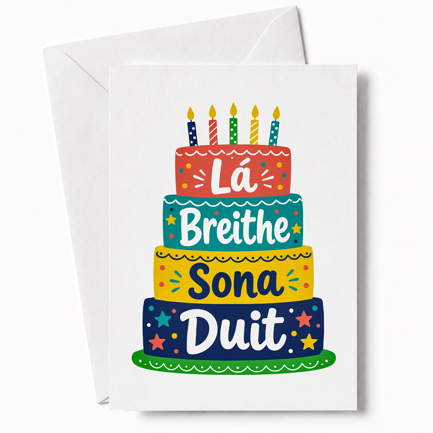 ILLUSTRATED IRISH BIRTHDAY CARD: "L&aacute; Breithe Sona Duit" is Happy Birthday in Irish, here across a joyful illustrated tiered birthday cake in pink, teal, yellow, and navy. A birthday card that feels considered and colourful, not like something grabbed off a shelf.