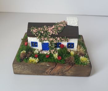 Beautiful tiny handcrafted Irish cottage, 10/8/7 cm , handcrafted from reclaimed wood ,features a lot of tiny decorations and a beautiful blue door!