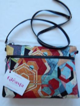 One of a kind double zippered crossbody bag in colourful tapestry.
Handmade in Ireland. Only one produced.