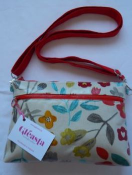 One of a kind double zippered crossbody bag made from
beige wipe clean coated cotton with a floral design.
Handmade in Ireland. Only one produced.