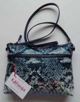Limited edition double zippered crossbody bag made from navy crocodile leatherette.
Handmade in Ireland. Only two produced.