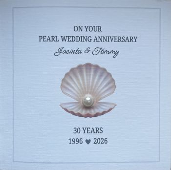 Celebrate 30 wonderful years of love with this elegant, personalised Pearl Wedding Anniversary keepsake card.
Handcrafted using premium&nbsp;6" x 6" luxury linen cardstock, this deluxe anniversary card features an elegant&nbsp;shell print with pearl gem detail, symbolising the beauty and rarity of a lasting marriage. Available in&nbsp;two beautiful designs, each card is personalised with the couple's&nbsp;names&nbsp;and&nbsp;wedding year, making it a truly unique keepsake they'll treasure forever.
Designed to mark this special milestone, the card combines timeless elegance with thoughtful personalisation, creating a meaningful gift in itself. Whether it's for your parents, grandparents, friends, or a cherished couple celebrating their Pearl Anniversary, this exquisite card is sure to become a treasured memento of their 30-year journey together.
Features:

Premium 6" x 6" luxury linen cardstock
Deluxe handcrafted design
Two beautiful shell print designs to choose from
Pearl gem detail
Personalised with names and wedding year
Unique keepsake to treasure for years to come
Perfect for celebrating a 30th Pearl Wedding Anniversary

A beautiful card for a beautiful love story&mdash;created to be cherished long after the anniversary celebrations have ended.