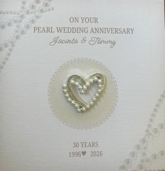 Celebrate a remarkable&nbsp;30th Pearl Wedding Anniversary&nbsp;with this elegant, personalised keepsake card, thoughtfully designed to commemorate thirty years of love and commitment.
Crafted from premium&nbsp;6" x 6" luxury linen cardstock, this deluxe anniversary card features a stunning&nbsp;diamond and pearl heart trinket, beautifully symbolising a love that has grown stronger and more precious with every passing year. The sparkling pearl and diamond details add a touch of timeless elegance, making this card a cherished keepsake long after the celebrations are over.
Personalise the card with the couple's&nbsp;names&nbsp;and&nbsp;wedding year&nbsp;to create a truly unique gift they'll treasure forever. Whether for your parents, grandparents, friends, or a special couple, this sophisticated design is the perfect way to celebrate a milestone filled with treasured memories.
Features:

Premium 6" x 6" luxury linen cardstock
Deluxe handcrafted design
Elegant diamond and pearl heart trinket
Personalised with names and wedding year
Luxury keepsake quality
Classy, timeless design
Perfect for celebrating a 30th Pearl Wedding Anniversary

A luxurious and meaningful keepsake card, created to honour thirty years of love, laughter, and unforgettable memories.