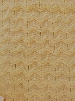 Hand-knit lemon ripples in the sand baby blanket.