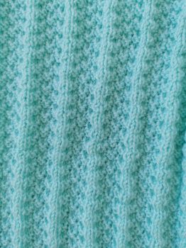 Mint green hand-knit baby blanket
