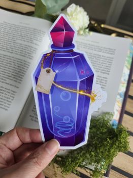Add a splash of magic to your reading stash! Shaped like a glowing crystal elixir bottle tied with a vintage label, this bookmark features swirling magical bubbles, glowing golden dust, and a vivid magenta gem stopper. Designed to be the ultimate companion for your favorite high-fantasy novels, spellbinding adventures, or cosy reading.&nbsp;