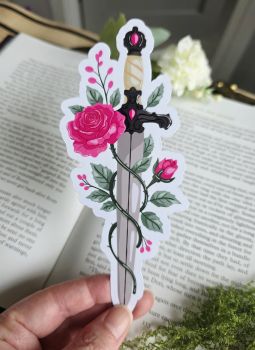 Combine danger and beauty in your current read! Featuring an ornate jewelled dagger wrapped in thorny vines, lush pink roses, and delicate botanical details, this die-cut bookmark is designed specifically for dark romance junkies, gothic fiction fans, and romantasy lovers.