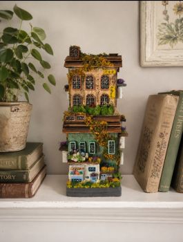 Handcrafted miniature wooden hotel-and-shop diorama.Hand-painted with an authentic stone texture, natural moss, dried flowers, and realistic grass. 12/26/12 cm is perfect as a shelf decor gift!