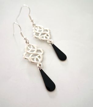 Elevate your style with a striking blend of traditional and modern elegance with these gorgeous celtic drop earrings!