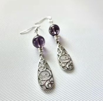 Add a touch of vintage romance to your look with these gorgeous lavender filigree earrings!
