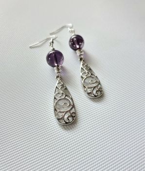 Add a touch of vintage romance to your look with these gorgeous lavender filigree earrings!
