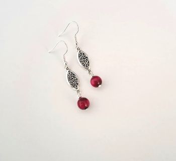 Capture the romance of vintage elegance with these gorgeous Tigers eye earrings! Created with beautiful sliver tone filigree pieces and shimmery tigers eye stones dyed in a rich deep pink.
