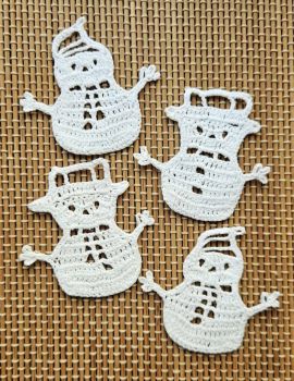 A beautiful, limited-edition set of 4 handmade crochet snowman ornaments with delicate openwork detailing and unique hat designs.