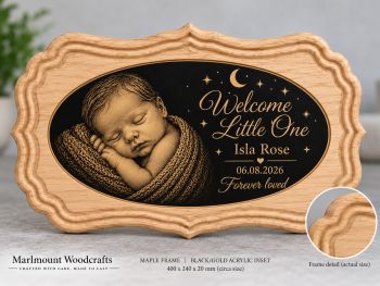 A handcrafted personalised newborn plaque made from carefully selected hardwood and individually created in Co. Louth, Ireland.
Each plaque features our distinctive carved scalloped frame with a contrasting inset, personalised with the baby&rsquo;s name, date of birth and chosen wording. Natural variations in grain, tone and character ensure that every plaque is unique.
Standard size: approximately 400 &times; 240 &times; 20 mm.
Available in a selection of hardwoods including Ash, Steamed Beech, Sapele, Cherry, Maple and Walnut, with contrasting inset options.
A design preview is provided before production so that names, dates and wording can be checked and approved.
&nbsp;
Presentation box included at no extra charge.