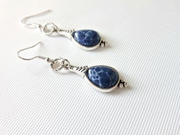 Add a touch of free spirited elegance to your look with these gorgeous deep blue marbled earrings!