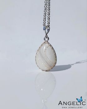 This customised breastmilk resin pendant features a timeless sterling silver teardrop (25 mm) suspended on a sturdy 45cm (18-inch) sterling silver necklace. Handcrafted in Ireland by Angelic DNA Jewellery, this piece is a deeply meaningful personalised breastmilk necklace, created to celebrate and honour your breastfeeding or pumping journey.
A truly unique keepsake gift, this breastmilk jewellery makes a beautiful choice for Mother&rsquo;s Day, Valentine&rsquo;s Day, weddings, birthdays, Christmas, or as a lasting memory for a new mother, baby, or child.
✨ Customisation details
Made using your own breastmilk
Created in white by default, unless otherwise specified in the personalisation section
Optional colour tones or subtle sparkle can be added if requested
🍼 Breastmilk submission
To create this pendant, you will need to send us up to 5 ml of breastmilk (any small amount can be used, with 5 ml being ideal). Full step-by-step instructions on how to safely post your breastmilk, along with our Waterford, Ireland address, will be sent to you after purchase.
This bespoke breastmilk jewellery pendant is perfect as a gift for your wife or partner, a new mum, a daughter, or as a treasured keepsake for yourself, something to cherish long after the breastfeeding journey has ended.